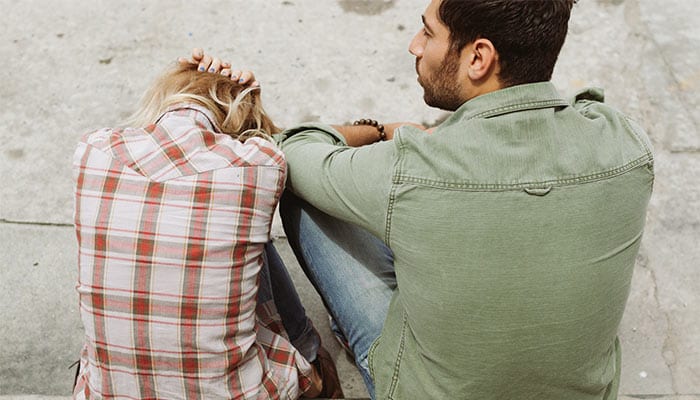 couple with woman crying