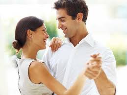 Smiling couple dancing together