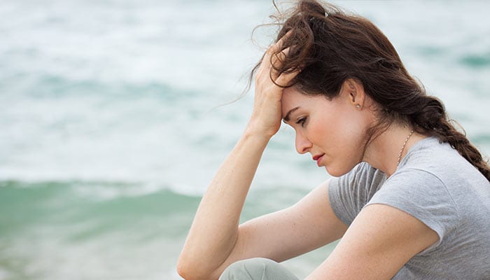 woman looking sad