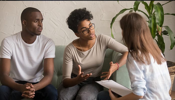 couple talking to therapist