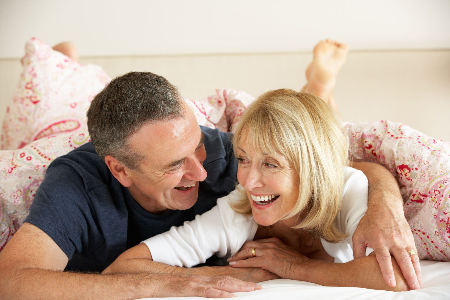 Senior,Couple,Relaxing,Together,In,Bed Senior Couple Relaxing Together In Bed